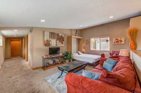 The full-sized Murphy bed magically appears by simply pulling the handles!