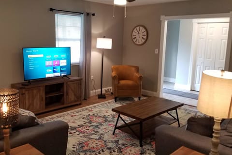 Living room with 50" Roku TV.