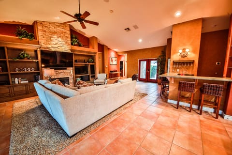 Kitchen opents to living room so you can watch on 70" tv and cook all at once