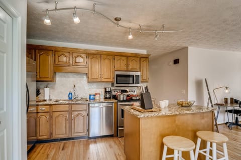 Cook, prepare, store, and serve food and drinks in the full size kitchen featuring many essentials.