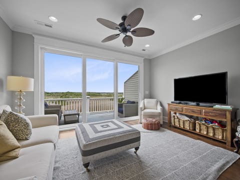 Bask in the natural beauty with tall ceilings and wall-to-wall sliding doors
