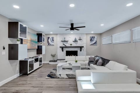 Modern living room equipped with a large flat-screen smart TV where you can chill and catch up on your favorite TV series.. If you have any questions at all, please send us an inquiry today!