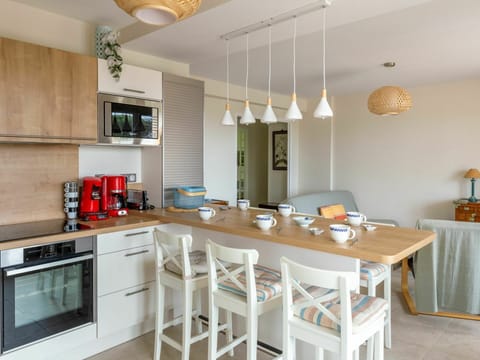 Furniture, Property, Table, Cabinetry, Wood, Countertop, Lighting, Interior Design, Flooring, Floor