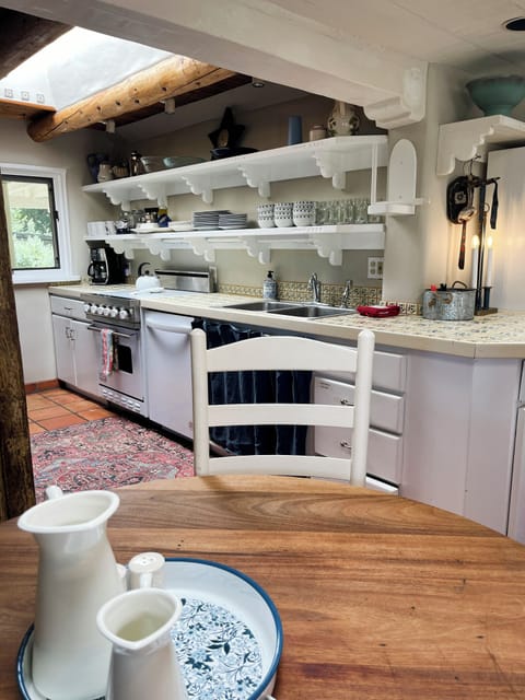 Kitchen dining table and view of kitchen