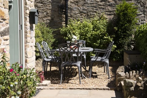 Theaked Stones Cottage, near Leyburn: South facing front garden with seating area for six guests