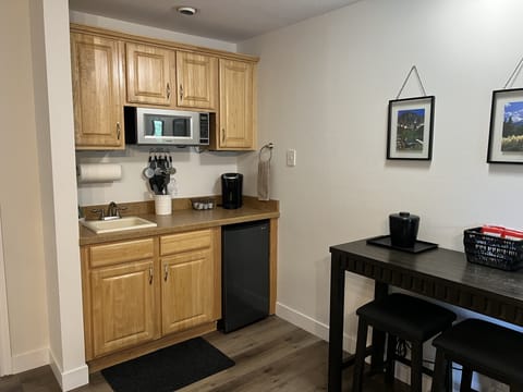 Kitchenette with mini-fridge, microwave, & portable electric 2-burner