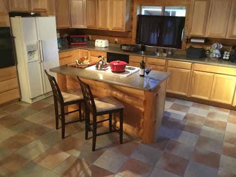 Large 18' x 18' well equipped eat in kitchen ready for your culinary expertise