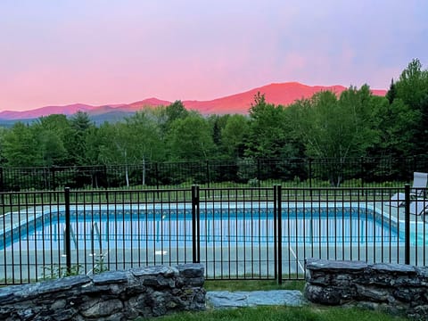 Known as the "Holden Frost House," it offers a rare outdoor saltwater pool, a bubbling hot tub, a fire pit for roasting marshmallows under the stars, and an inviting swing overlooking the mountains