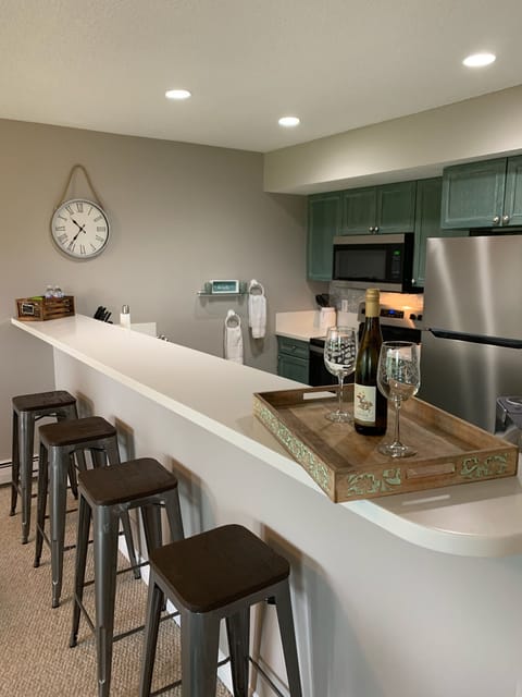 Bar area provides for extra seating or a space to enjoy some wine.