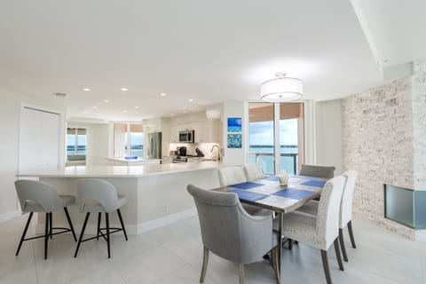 Large, open dining area with panoramic water views.