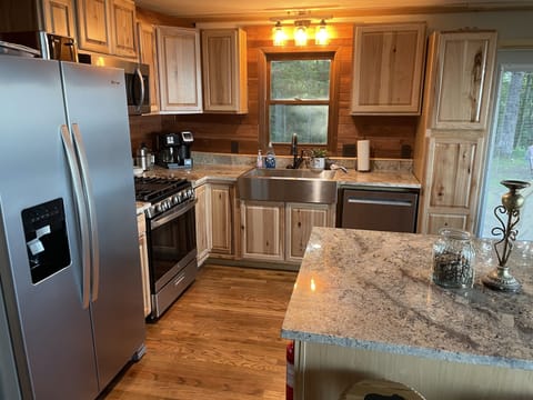 Beautiful well stocked CHEF'S KITCHEN dream kitchen w/ granite counters & view