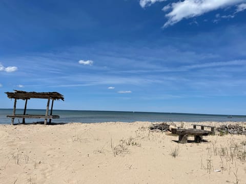100 ft of privates sandy beach with rustic fire pit and tiki bar