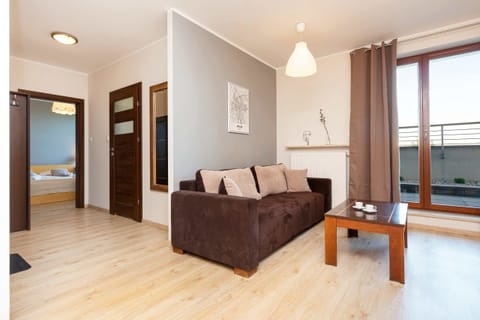 Living room with a comfortable sofa and TV. 