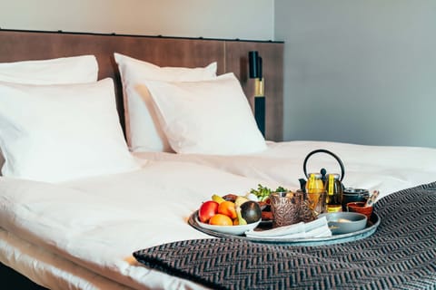 Premium bedding, down comforters, pillowtop beds, minibar