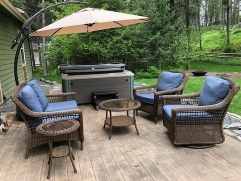 Enjoy the outdoor living space. The patio has great seating and a HOT TUB!