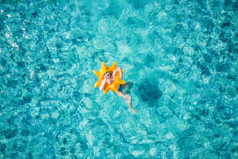Seasonal outdoor pool, open 7:30 AM to 6:00 PM, free cabanas