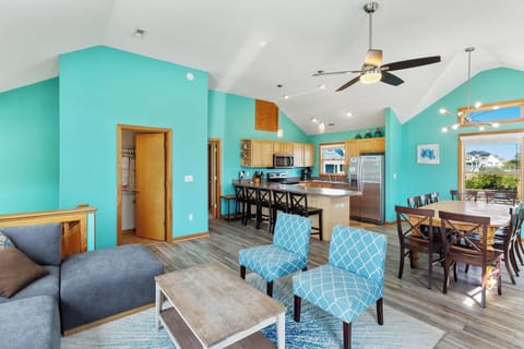 Enjoy time together in the spacious Living Area with High Ceilings and Lots of Light! (*Please note: Fireplace is not for guest use.)