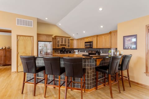 The kitchen will be an inspiration for any family chef thanks to stainless steel appliances and a posh adjacent breakfast bar.