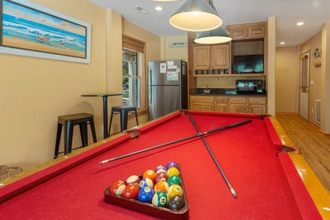 Have some fun in the Game Room with a Pool Table, TV, and Wet Bar!