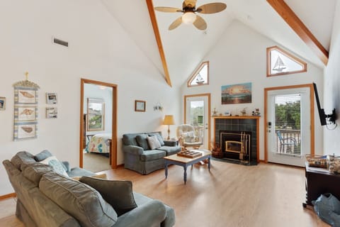 Living Area: Bright, inviting living space with updated furniture and abundant natural light.