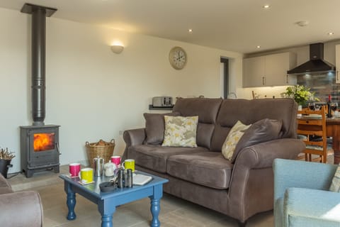 Cosy up in front of the wood burning stove at the end of the day