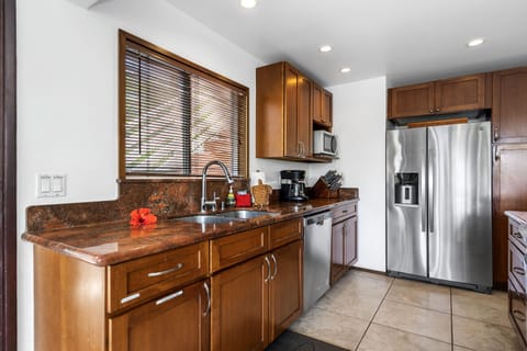 Second floor fully equipped kitchen with stainless appliances.