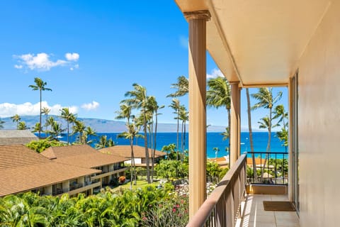 Step onto your private balcony and soak in breathtaking ocean views framed by swaying palms. Feel the tropical breeze as you gaze across vibrant gardens to sparkling blue waters and distant mountains.