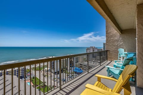 Private penthouse balcony with panoramic ocean views and endless coastal horizons.