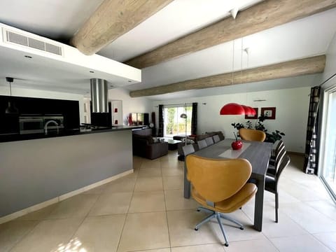 Large air-conditioned living room with open kitchen