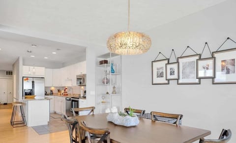 The attached dining area has seating for six at the table as well as two seats at the kitchen island.
