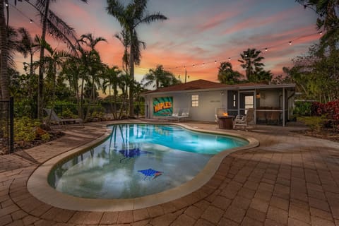 Enjoy a private, poolside paradise lit up at night by string lights and firepit!