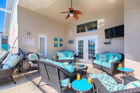 Lanai with comfortable seating and TV