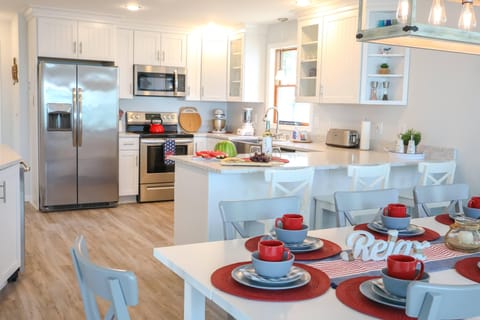Well stocked kitchen with stainless steel appliances