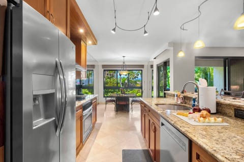 View with back to entry- looking through kitchen to nook and courtyard. 