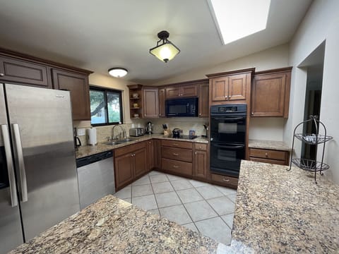 Full kitchen with updated appliances and granite counter