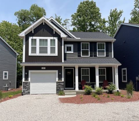 Harbor Hideaway offers a modern, welcoming retreat with a bright front porch.