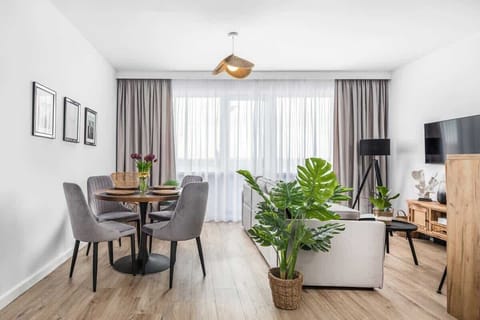 Living room with a comfortable sofa and TV. 
