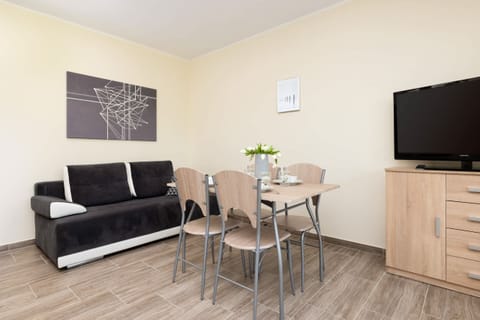 Living room with a comfortable sofa and TV. 