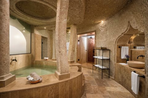 Suite (Karamanoglu Ibrahim Cave) | Bathroom | Rainfall showerhead, designer toiletries, hair dryer, bathrobes