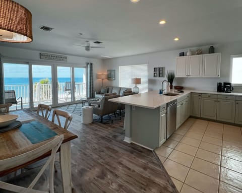 Beachfront kitchen, dining room, and living room. Plus bar stool - Beachfront kitchen, dining room, and living room. Plus bar stool seating off of the kitchen for a quick meal or snack!