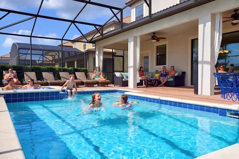 Enclosed saltwater pool & spa, privacy bushes 6 lounge chairs outdoor sectional