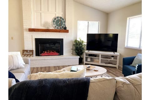 Cozy living room with Electric Fireplace, plenty of seating and Smart TV