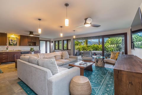 Downstairs living area that opens up to the lanai