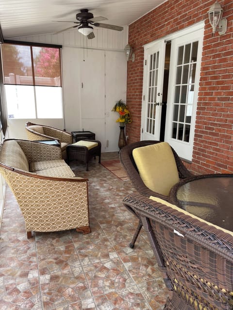 Four Seasons Room: Table and chairs, Couch, private area surrounded by fence. 