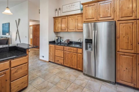 Large fridge with a coffee bar and additional sink
