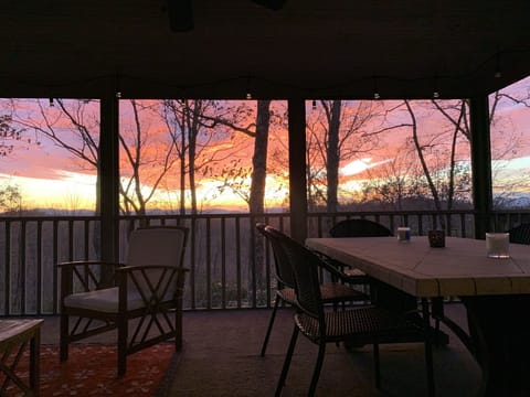 Sunset over distant mountains from screened porch, November 2021