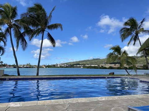 Take a swim after work and relax by the pool overlooking the marina