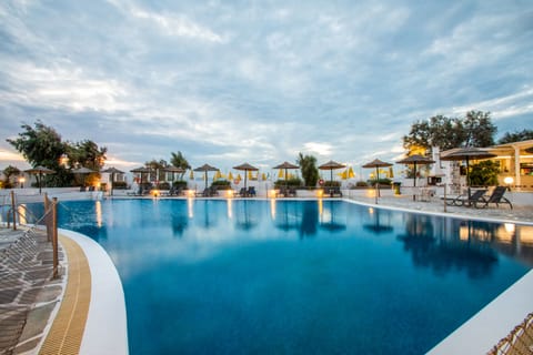 Outdoor pool, open 10:00 AM to 6:00 PM, pool umbrellas, sun loungers