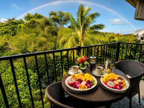 Private lanai surrounded by lush greenery, perfect for morning coffee