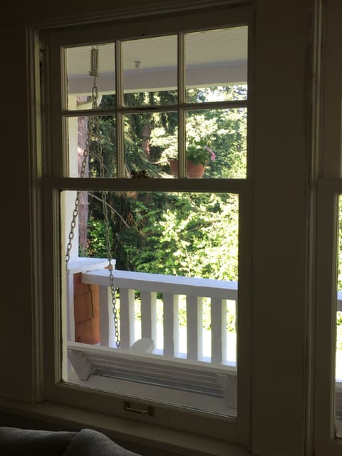 Original leaded glass double-hung windows in the living room, entry, & bedrooms.